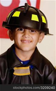 Portrait of a boy wearing a fireman costume