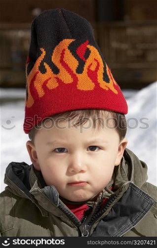 Portrait of a boy wearing a knit hat