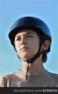 Portrait of a boy wearing a skateboard helmet