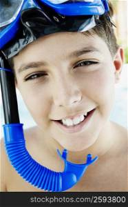 Portrait of a boy wearing a snorkel and scuba mask