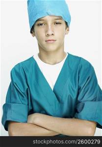 Portrait of a boy wearing surgical scrubs