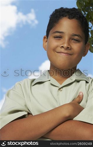 Portrait of a boy with his arms crossed