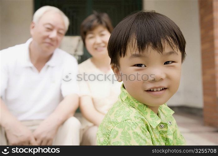 Portrait of a boy with his grandparents