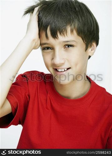 Portrait of a boy with his hand in his hair