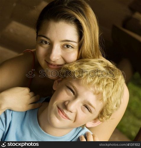 Portrait of a brother and his sister smiling