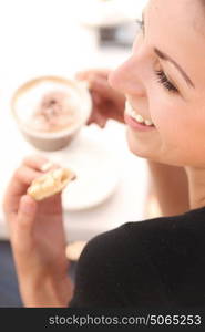 Portrait of a brunette lady during the coffee break