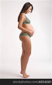 Portrait of a brunette pregnant mother