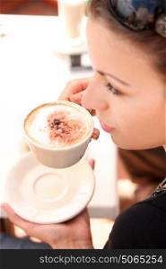 Portrait of a brunette woman during the coffee break