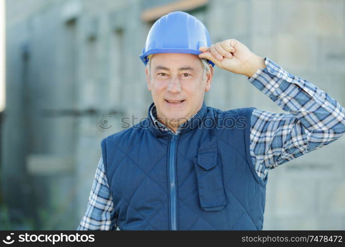 portrait of a builder in helmet