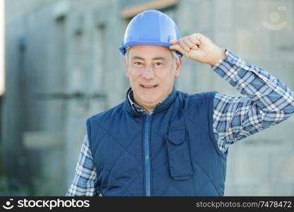 portrait of a builder in helmet