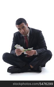 Portrait of a business man holding and catch falling money bills, isolated on white background in studio