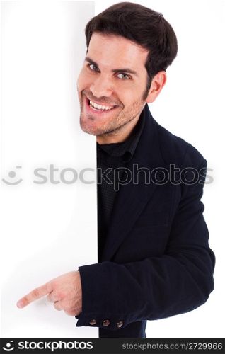 Portrait of a business man pointing at the blank board wtih copy space