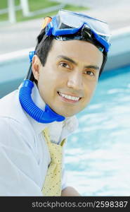 Portrait of a businessman a snorkel and smiling
