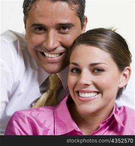 Portrait of a businessman and a businesswoman smiling