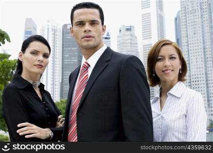 Portrait of a businessman and two businesswomen