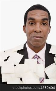 Portrait of a businessman covered with adhesive notes