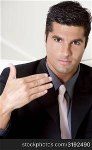 Portrait of a businessman gesturing