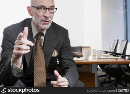 Portrait of a businessman gesturing