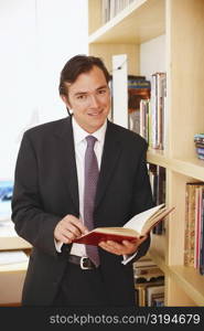 Portrait of a businessman holding a diary