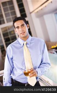 Portrait of a businessman holding a glass of wine