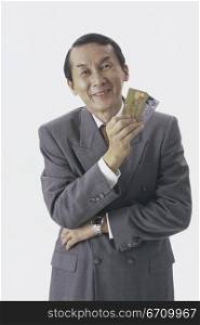 Portrait of a businessman holding credit cards