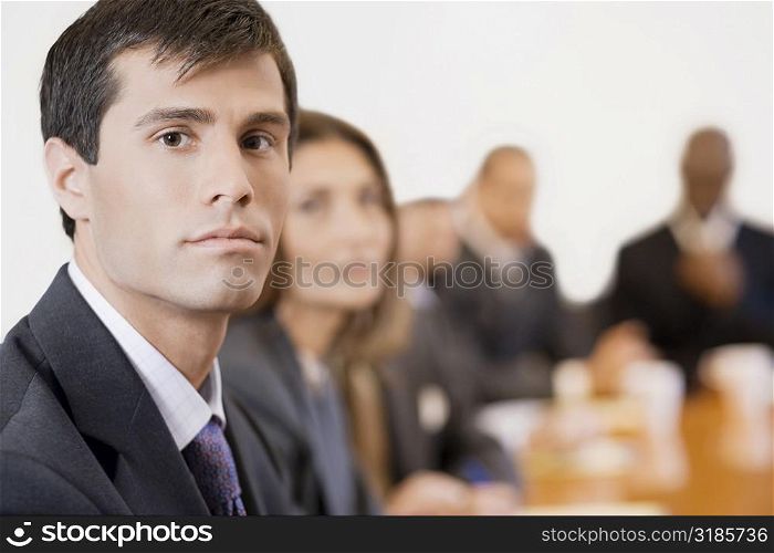 Portrait of a businessman in a board room
