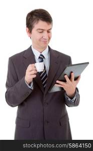 Portrait of a businessman looking at tablet pc and holding cup of coffee, isolated