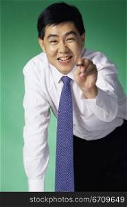 Portrait of a businessman pointing