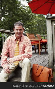 Portrait of a businessman sitting and smiling