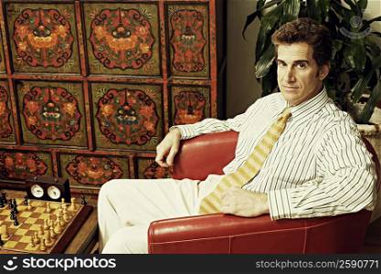 Portrait of a businessman sitting in an armchair