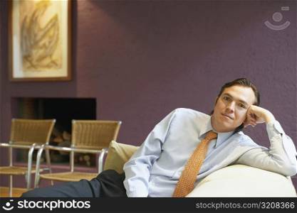 Portrait of a businessman sitting on a couch