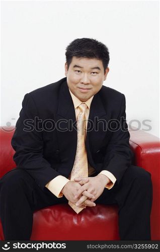Portrait of a businessman sitting on a couch