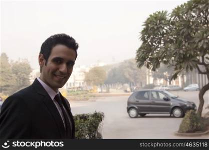 Portrait of a businessman smiling , INDIA , DELHI