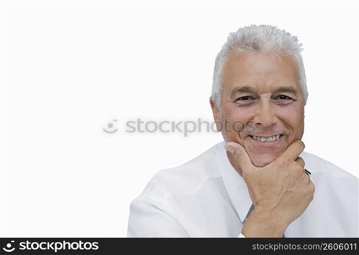 Portrait of a businessman smiling with his hand on his chin