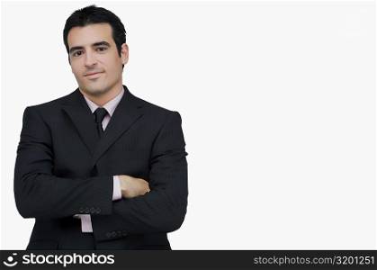 Portrait of a businessman standing with his arms crossed