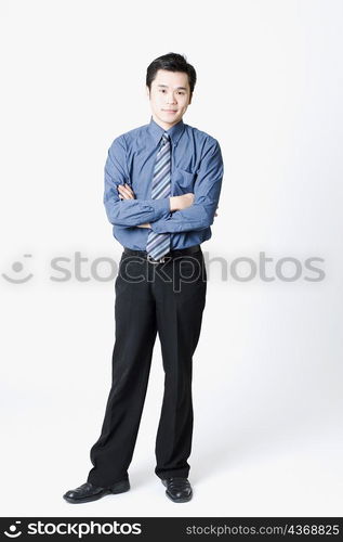 Portrait of a businessman standing with his arms crossed