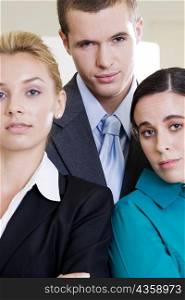 Portrait of a businessman standing with two businesswomen
