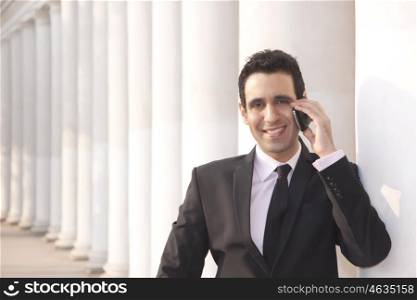 Portrait of a businessman talking on a mobile phone , INDIA , DELHI