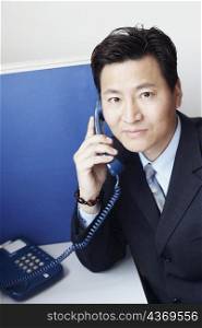 Portrait of a businessman talking on the telephone