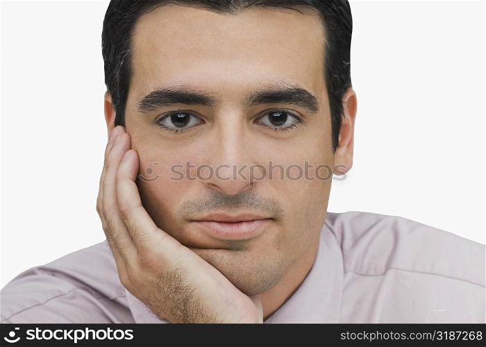 Portrait of a businessman thinking with his hand on his chin