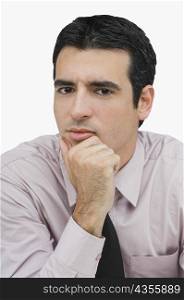 Portrait of a businessman thinking with his hand on his chin