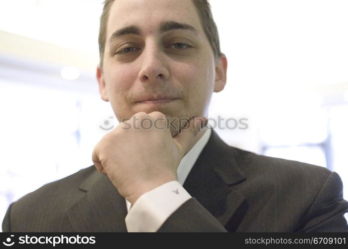 Portrait of a businessman thinking with his hand on his chin