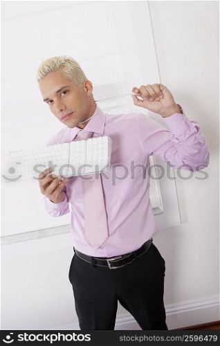 Portrait of a businessman using a computer cable as a noose