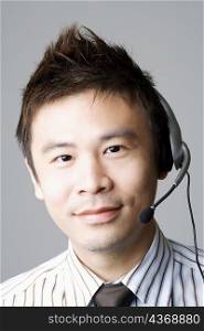 Portrait of a businessman using a headset