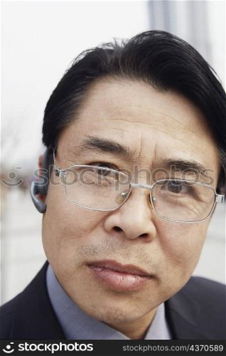 Portrait of a businessman wearing a hands free device