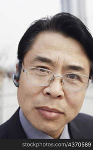 Portrait of a businessman wearing a hands free device