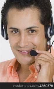Portrait of a businessman wearing a headset and smiling