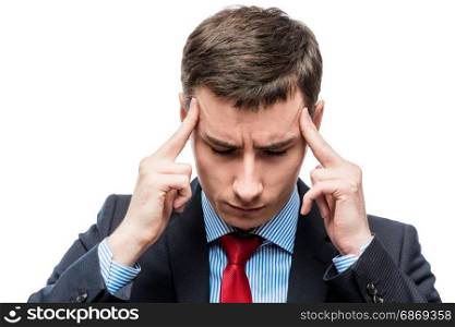Portrait of a businessman with a strong headache and troubles in business on a white background