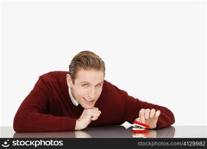 Portrait of a businessman with dentures on a table