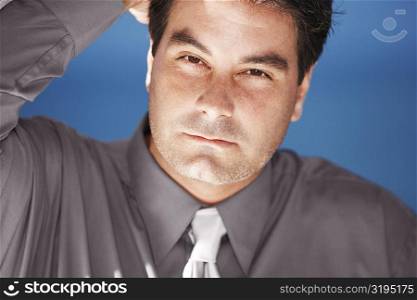 Portrait of a businessman with his hand in his hair
